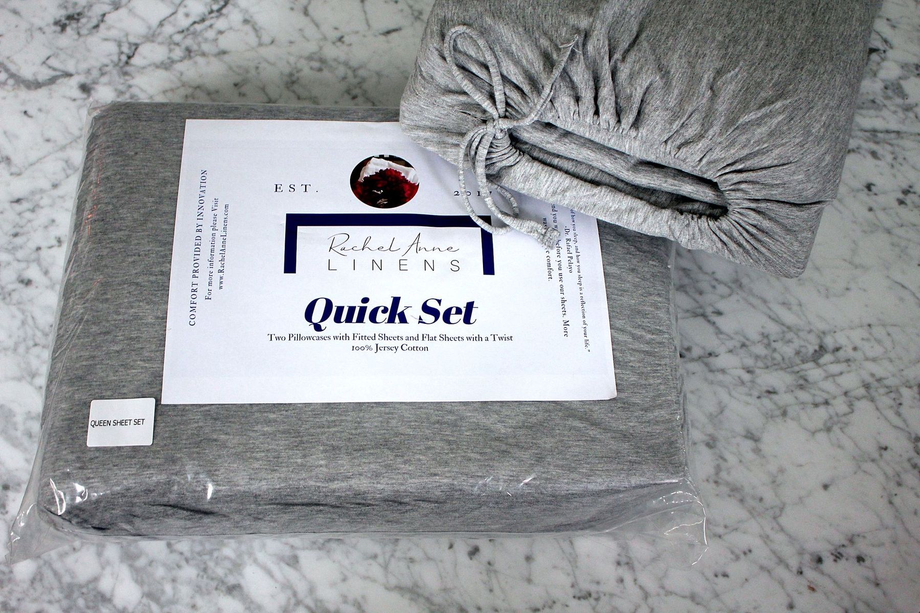 The Quick Set in its package, next to its drawstring bag